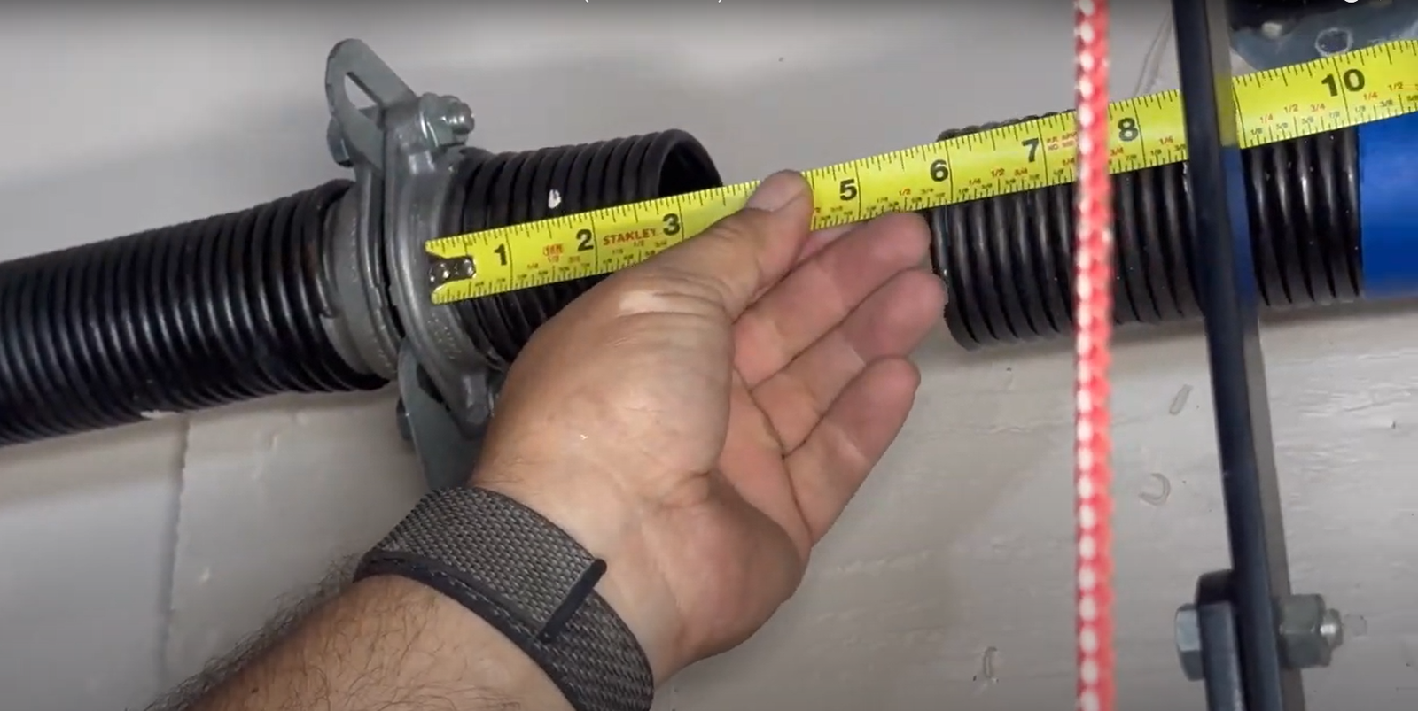 Professional technician performing garage door spring repair in Granville, Ohio